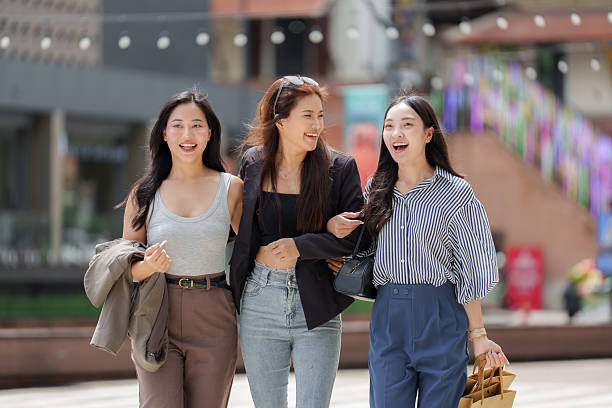 istock Three asian women walking and smiling together 2237257843