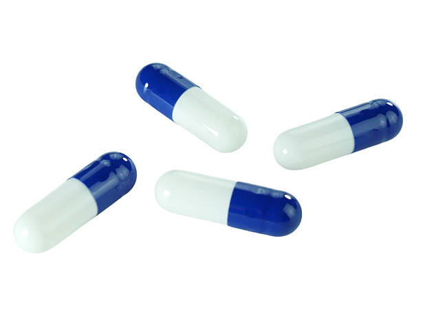 istock Bulk blue and white capsule pills isolated on white background. 2237258164