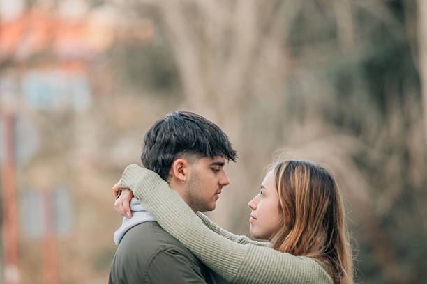istock young romantic couple on the street hugging 2237258364