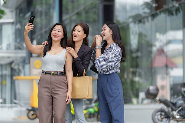 istock Three friends taking selfie with smartphone feeling happy 2237258404