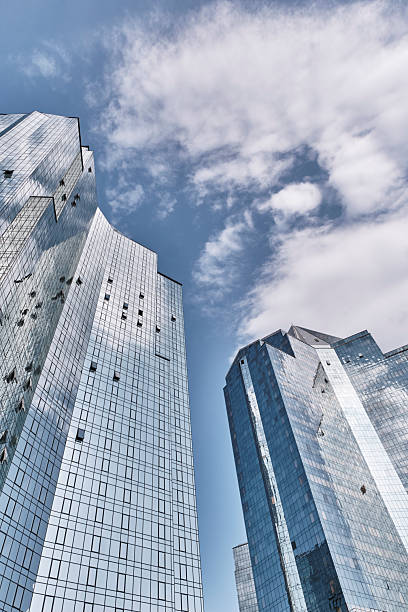 istock Modern glass skyscrapers against blue sky 2237260043