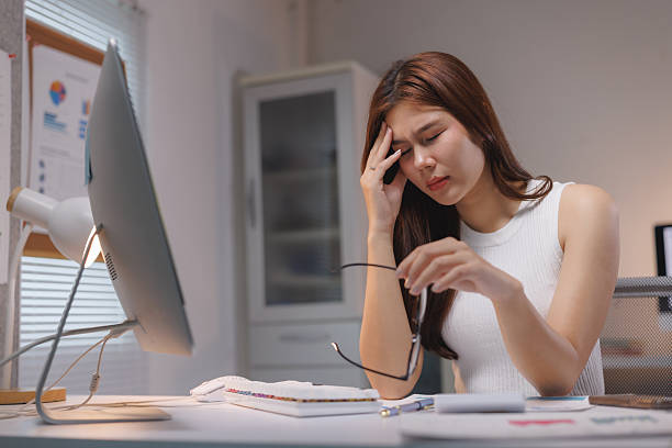 istock Young woman suffering headache from office work stress 2237262692