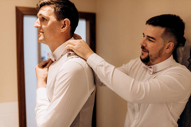 istock A groom in a three-piece suit gets ready for a wedding in the morning 2237265585