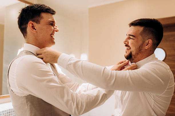 istock A groom in a three-piece suit gets ready for a wedding in the morning 2237265761