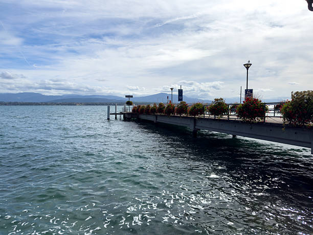 A pier with a dock and a pier with a dock. The water is calm and the sky is cloudy