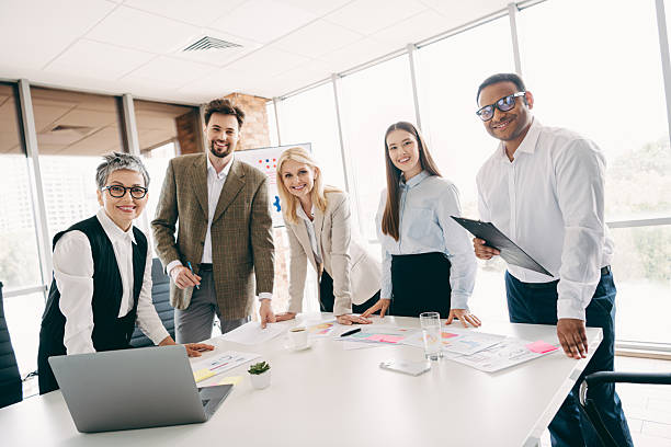 istock Professional team collaboration in modern office setting with diverse colleagues working together on project plans 2237271071