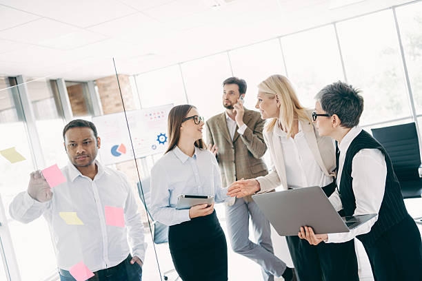 istock Business professionals collaborating during a project meeting in a modern office setting with teamwork and ideas 2237271102