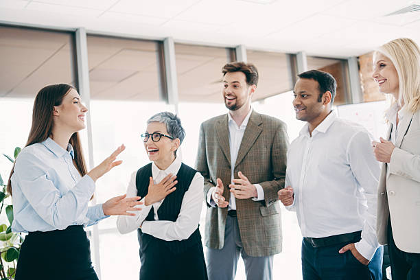 istock Professional team engages in lively brainstorming session, fostering collaboration and communication in a modern office setting 2237271113
