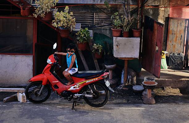 boy riding electric bikes in residential area