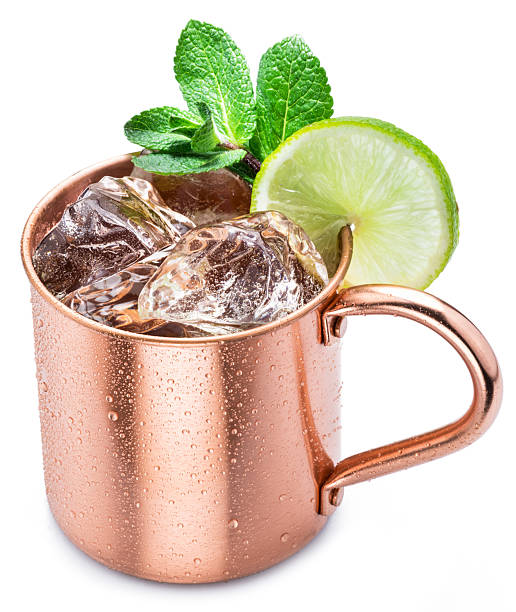 istock Copper cup with Moscow mule drink decorated with lime and mint leaves white background. Clipping path. 2237273225