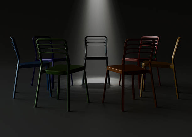 istock Highlighted Chair in Circle Under Spotlight on Dark Background 2237275027