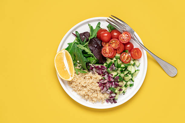 istock Quinoa salad on yellow background 2237279351