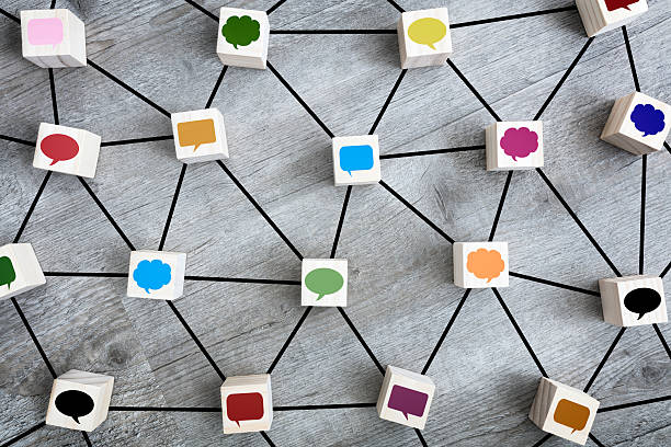istock Online messaging, social media, networking, communication and discussion concept wood blocks and speech bubble icons 2237279815