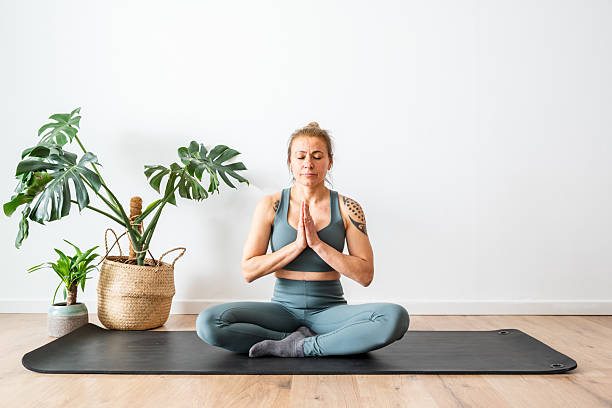 istock Woman Practicing Yoga Indoors With Focus and Tranquility in a Modern Space 2237281643