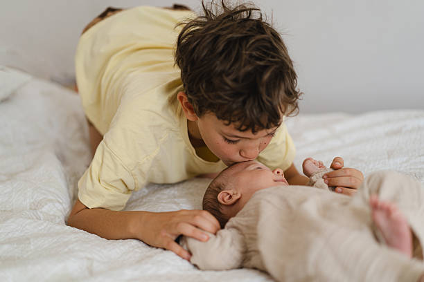 istock Two brothers enjoying playing in cozy bright bedroom 2237281944