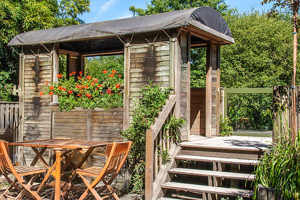istock Wooden shelter with garden table and chairs 2237284850