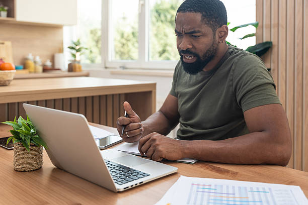 istock Young university student, freelancer business man, working at home on laptop computer, testing new innovative technology and online internet tools while sitting in home office. 2237286910