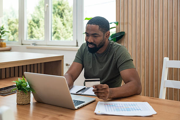 istock Young university student, freelancer business man, working at home on laptop computer, testing new innovative technology and online internet tools while sitting in home office. 2237286922