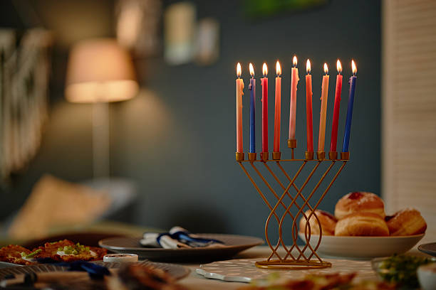 istock Hanukkah Menorah with Lit Candles Standing on Table during Festive Celebration 2237287004