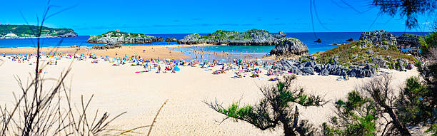 A beautiful beach with sunset light. Somocuevas beach in Liencres, Cantabria, Spain