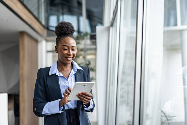istock Young black businesswoman using digital tablet in modern office 2237290339