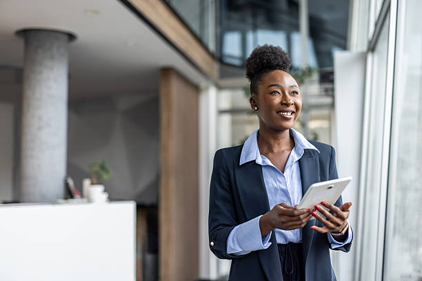 istock Confident black businesswoman using digital tablet in modern office 2237290344