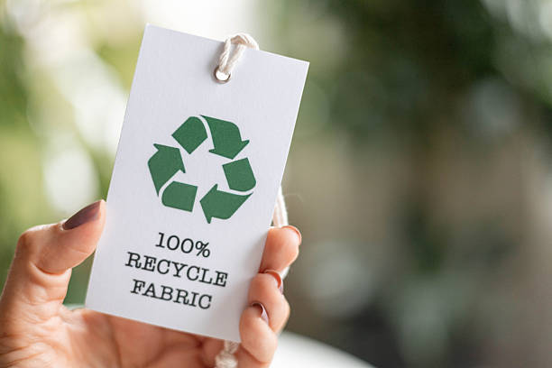 istock Hand holding recycle fabric tag promoting sustainable eco-friendly textile production 2237291650