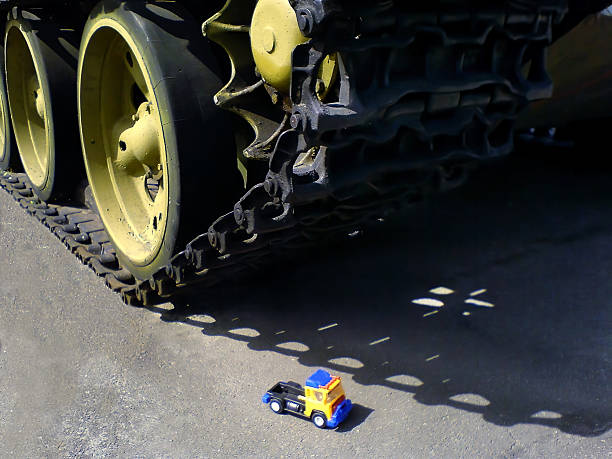 Car toy under the panzer. Concept military actions. War.