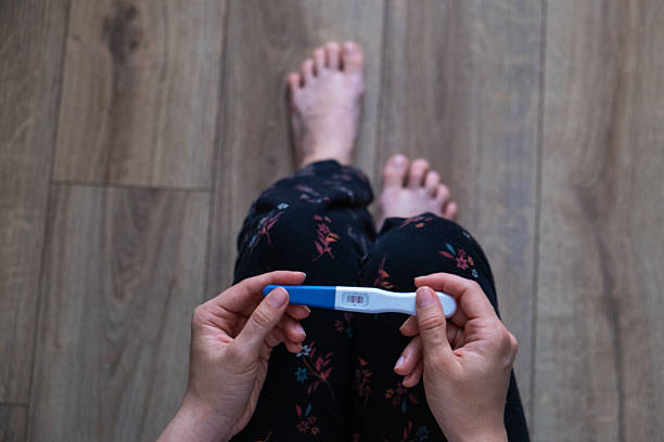 istock Positive Pregnancy Test in Hand 2237294174