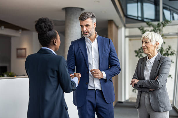 istock Business people shaking hands in modern office meeting 2237294225