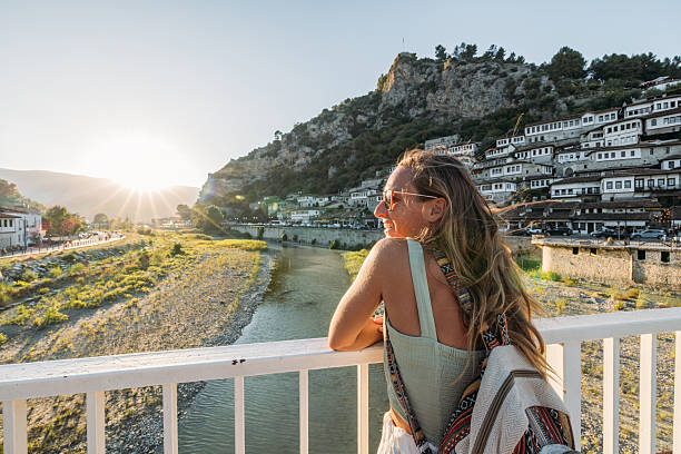 istock Woman Enjoying Sunset View on Bridge 2237295959