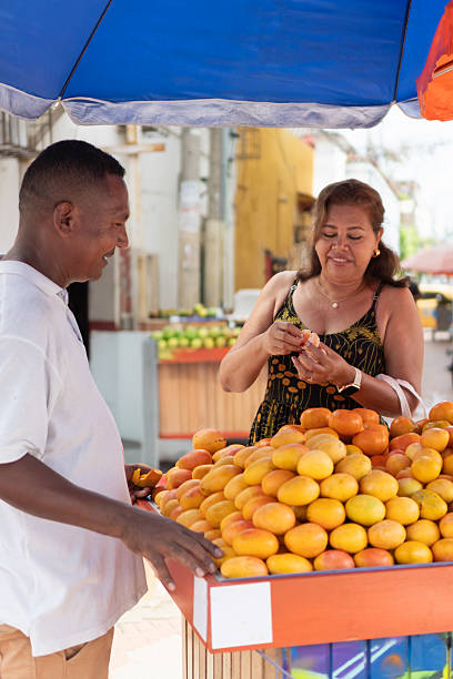 istock People interacting at street market fruit stand 2237296392