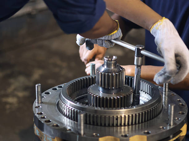 istock Close-up of a person's hands working on transmission grader planetary 2237301840