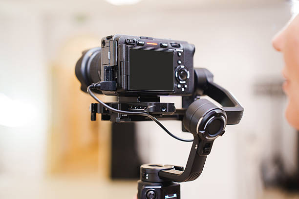 istock Camera setup on a tripod with a gimbal for steady shooting indoors 2237305062