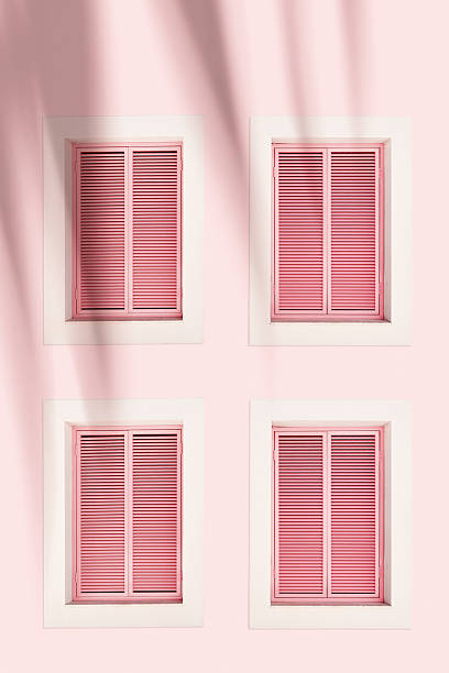istock Minimal summer aesthetic pattern with pink shutter windows on pastel wall. Natural sunlight palm leaf shadows, modern design. Concepts of summer, vacation, tropical style architecture, home decor 2237305082