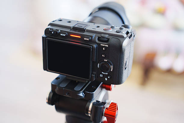 istock Camera on tripod ready for a photo session in a bright studio space 2237305766