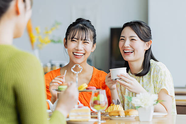istock Young woman enjoying afternoon tea at a cafe 2237310624
