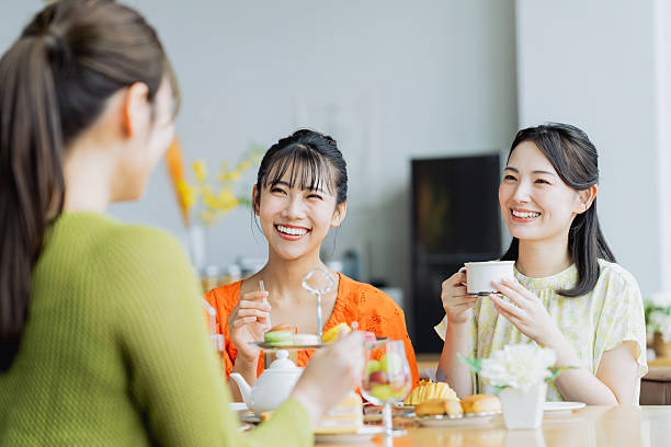 istock Young woman enjoying afternoon tea at a cafe 2237310629