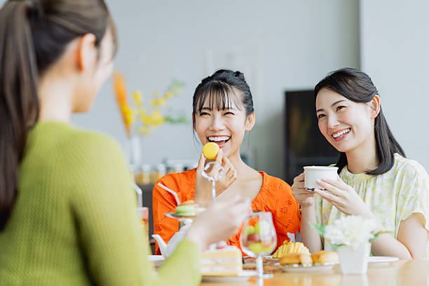 istock Young woman enjoying afternoon tea at a cafe 2237310630