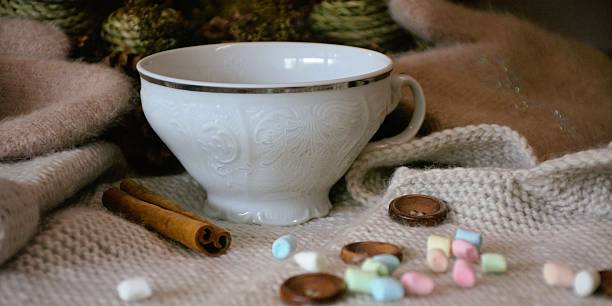 istock Coffee cup with colorful marshmallows on fabric. 2237311327