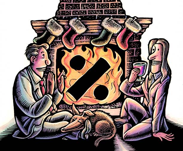 couple sitting by a christmas hearth with a percent sign in the flames of fireplace