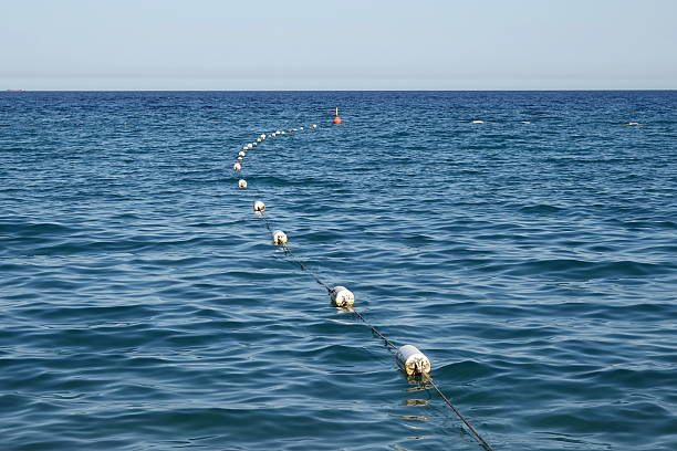 Buoys are bright, floating signs that serve as navigational markers at sea, indicating safe routes and the boundaries of dangerous zones. On beaches, they create a safe swimming area, protecting people from the dangers of open water and currents.