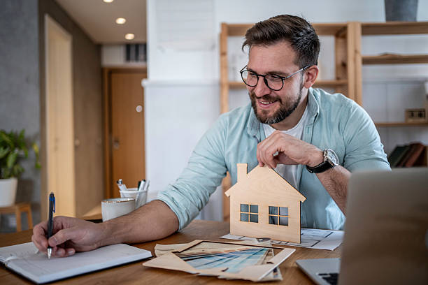 istock Man planning new home design in his home office 2237317370