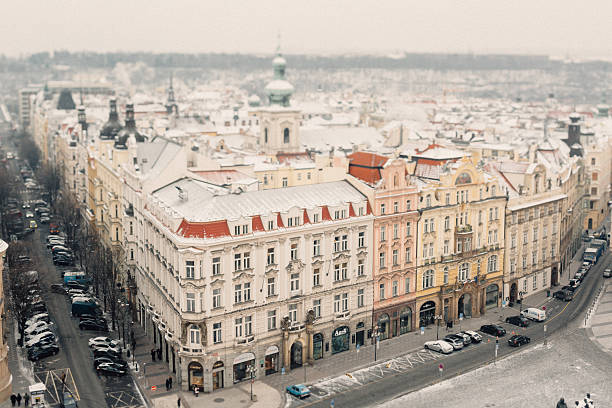 A stunning aerial view of a snow-covered cityscape showcasing historical buildings and a serene winter atmosphere.