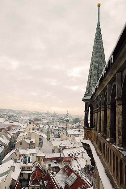 istock Winter Cityscape with Snow-Covered Rooftops and Church Spire 2237320740