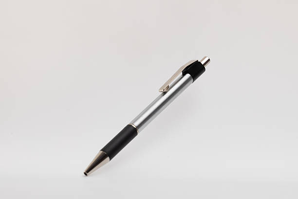 istock Black and silver-tipped pen on white background. 2237322366