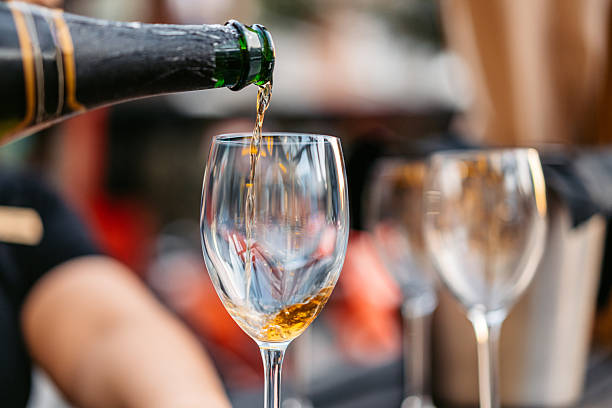 istock Pouring Aged White Wine In A Restaurant Outdoors 2237322454