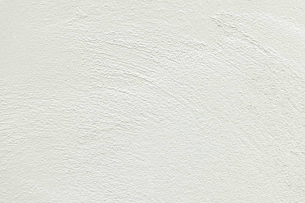 istock Close-up macro white concrete wall texture,White concrete wall texture featuring a rough surface, creating an intriguing abstract design ideal for backgrounds and textured overlays, adding depth to various projects. 2237323185