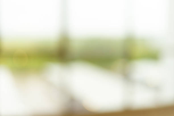 istock Blurred interior glass background,Blur office background building exterior view to lobby glass window wall with blurry light bokeh. 2237323276
