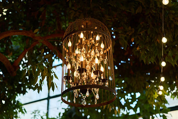 istock An Elegant Chandelier Surrounded by Lush Greenery, Set in a Charming Rustic Environment 2237323334